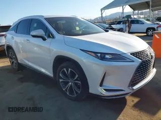 2022 Lexus RX with VIN 2T2HGMDA8NC074588, listed as a IAAI auction lot 41828234 with 106,845 mi miles. Bid and sale history available at carsss.com. Image 1.