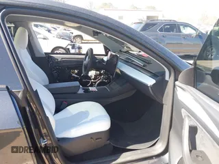 2024 Tesla Model Y Performance with VIN 7SAYGDEF1RA329825, listed as a IAAI auction lot 41762602 with 3,923 mi miles and . Bid and sale history available at DreamBid. Image 5.