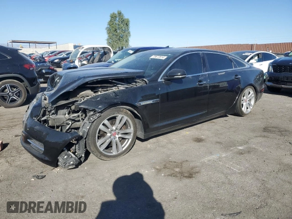 2014 Jaguar XJ with VIN SAJWA2GZXE8V59542, listed as a Copart auction lot 73672614 with 105,328 mi miles and Salvage Title. Bid and sale history available at carsss.com. Image 1.