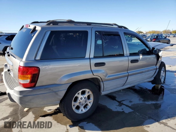 1999 Jeep Grand Cherokee Laredo with VIN 1J4GW58NXXC776438, listed as a Copart auction lot 84412044 with 163,060 mi miles and Salvage title. Bid and sale history available at DreamBid. Image 3.