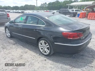 2013 Volkswagen CC Lux with VIN WVWRP7AN2DE525995, listed as a IAAI auction lot 42105042 with 148,818 mi miles. Bid and sale history available at carsss.com. Image 3.