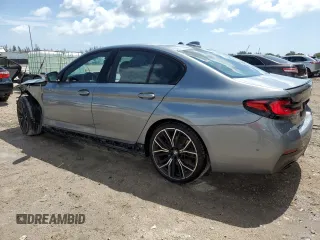 2023 BMW 5 Series 530i with VIN WBA53BH02PCM55841, listed as a Copart auction lot 58391765 with 6,947 mi miles and Salvage title. Bid and sale history available at DreamBid. Image 2.