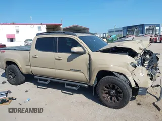 2018 Toyota Tacoma SR5 z VIN 3TMDZ5BN4JM039802, wystawiony jako IAAI lot #42300924 z przebiegiem 48 828 mil mil oraz . Historia ofert i sprzedaży dostępna na DreamBid. Obrazek 13.