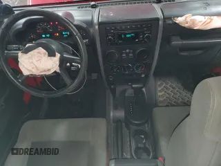 2008 Jeep Wrangler X with VIN 1J4FA24118L501599, listed as a Copart auction lot 52776475 with 74,186 mi miles and Salvage Title. Bid and sale history available at DreamBid. Image 8.