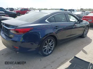 2016 Mazda 6 i Grand Touring with VIN JM1GJ1W59G1439075, listed as a IAAI auction lot 41792755 with 99,215 mi miles and . Bid and sale history available at DreamBid. Image 4.