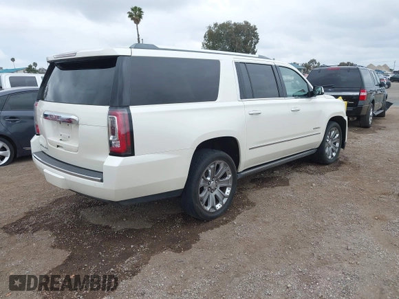 2015 GMC Yukon XL Denali with VIN 1GKS2JKJ7FR641430, listed as a IAAI auction lot 42163969 with 129,085 mi miles. Bid and sale history available at carsss.com. Image 4.