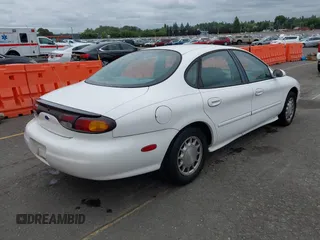 1997 Ford Taurus LX z VIN 1FALP53S0VG291879, wystawiony jako IAAI lot #42498197 z przebiegiem 266 886 mil mil oraz . Historia ofert i sprzedaży dostępna na DreamBid. Obrazek 4.