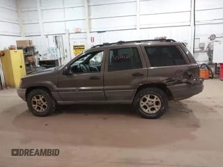 2000 Jeep Grand Cherokee Laredo z VIN 1J4GW48S1YC277710, wystawiony jako IAAI lot #42033564 z przebiegiem Nie podano mil oraz . Historia ofert i sprzedaży dostępna na DreamBid. Obrazek 14.
