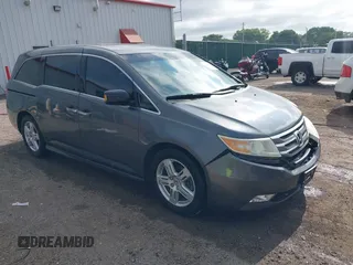 2011 Honda Odyssey Touring with VIN 5FNRL5H98BB053211, listed as a IAAI auction lot 42494162 with 201,373 mi miles and . Bid and sale history available at DreamBid. Image 1.