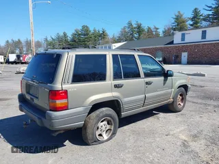 1997 Jeep Grand Cherokee Laredo with VIN 1J4GZ58S7VC713517, listed as a IAAI auction lot 42062214 with 205,533 mi miles. Bid and sale history available at carsss.com. Image 6.