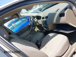 2007 Ford Focus SE z VIN 1FAFP36N77W130848, wystawiony jako IAAI lot #41986099 z przebiegiem 65 649 mil mil oraz . Historia ofert i sprzedaży dostępna na DreamBid. Obrazek 5.