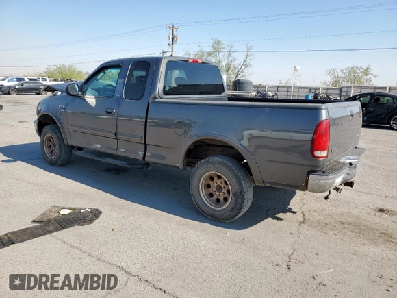 2002 Ford F-150 XL with VIN 1FTPX18L32NB65156, listed as a Copart auction lot 61418955 with 176,622 mi miles and Salvage title. Bid and sale history available at DreamBid. Image 2.
