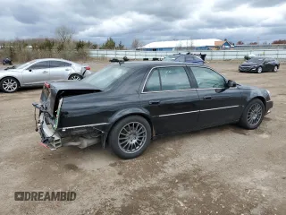 2007 Cadillac DTS Performance with VIN 1G6KD57937U201301, listed as a Copart auction lot 52868565 with 119,972 mi miles and Salvage Title. Bid and sale history available at carsss.com. Image 3.