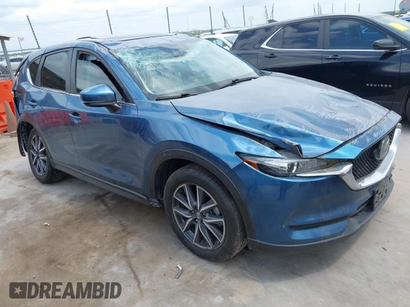 2018 Mazda CX-5 Touring z VIN JM3KFACM5J1442416, wystawiony jako IAAI lot #42093137 z przebiegiem 65 102 mil mil oraz . Historia ofert i sprzedaży dostępna na DreamBid. Obrazek 1.