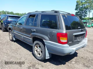 2000 Jeep Grand Cherokee Laredo with VIN 1J4GW48S8YC380039, listed as a IAAI auction lot 42510307 with 215,776 mi miles and . Bid and sale history available at DreamBid. Image 3.