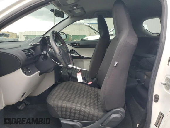 2013 Scion iQ with VIN JTNJJXB01DJ022687, listed as a Copart auction lot 61918195 with 117,483 mi miles and Salvage title. Bid and sale history available at DreamBid. Image 7.