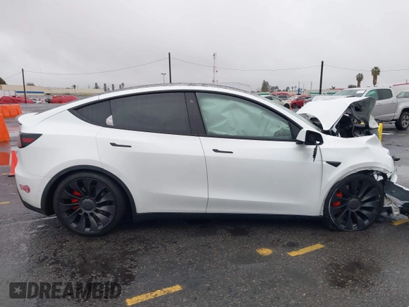 2022 Tesla Model Y Performance with VIN 7SAYGDEFXNF384268, listed as a IAAI auction lot 41558359 with 33,870 mi miles and . Bid and sale history available at DreamBid. Image 12.
