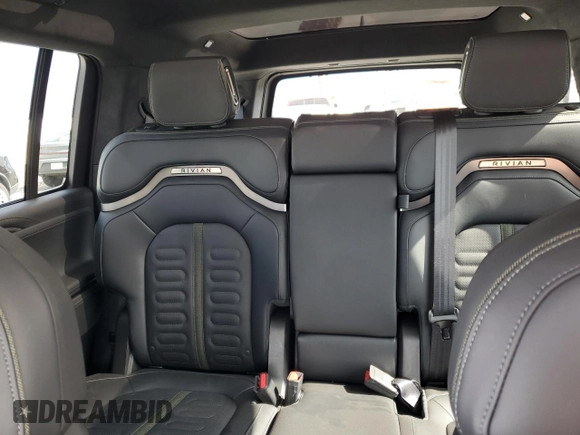 2025 Rivian R1S Adventure z VIN 7PDSGBBA1SN051768, wystawiony jako Copart lot #43838115 z przebiegiem 4875 mil mil oraz Szkoda całkowita • Salvage title. Historia ofert i sprzedaży dostępna na DreamBid. Obrazek 10.