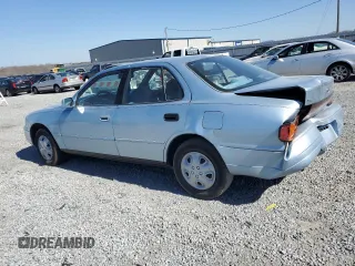 1992 Toyota Camry LE with VIN 4T1SK12E7NU001465, listed as a Copart auction lot 46937175 with 141,334 mi miles and Salvage Title. Bid and sale history available at carsss.com. Image 2.