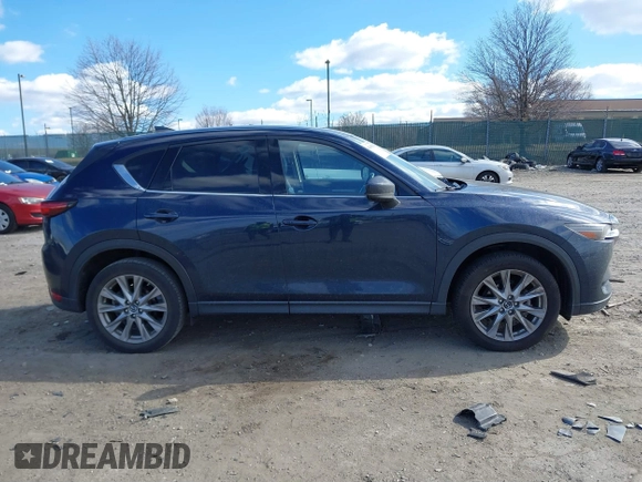 2020 Mazda CX-5 Grand Touring with VIN JM3KFBDM2L0768770, listed as a IAAI auction lot 41695058 with 44,192 mi miles. Bid and sale history available at carsss.com. Image 12.