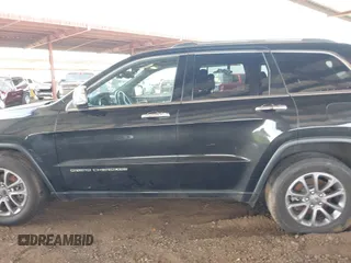 2014 Jeep Grand Cherokee Limited z VIN 1C4RJFBM9EC409093, wystawiony jako IAAI lot #42255242 z przebiegiem 121 059 mil mil oraz . Historia ofert i sprzedaży dostępna na DreamBid. Obrazek 14.