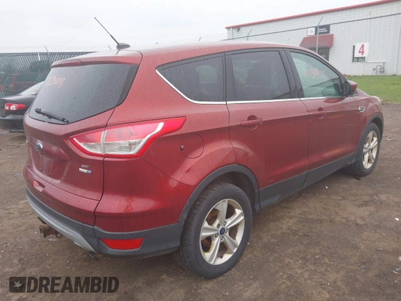 2014 Ford Escape SE with VIN 1FMCU9G97EUC50213, listed as a IAAI auction lot 42130075 with 235,406 mi miles. Bid and sale history available at carsss.com. Image 4.