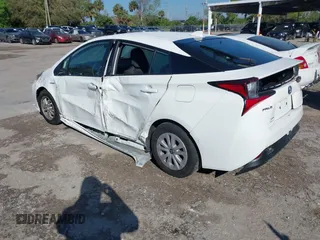 2022 Toyota Prius L Eco with VIN JTDKAMFUXN3163123, listed as a IAAI auction lot 41666679 with 68,026 mi miles. Bid and sale history available at carsss.com. Image 3.