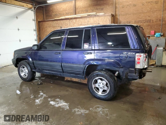 1997 Jeep Grand Cherokee Laredo with VIN 1J4GZ58Y7VC678708, listed as a Copart auction lot 87803725 with 312,585 mi miles and Salvage Title. Bid and sale history available at carsss.com. Image 2.
