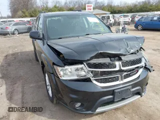 2013 Dodge Journey SXT with VIN 3C4PDCBBXDT675818, listed as a IAAI auction lot 41797205 with 141,271 mi miles. Bid and sale history available at carsss.com. Image 1.
