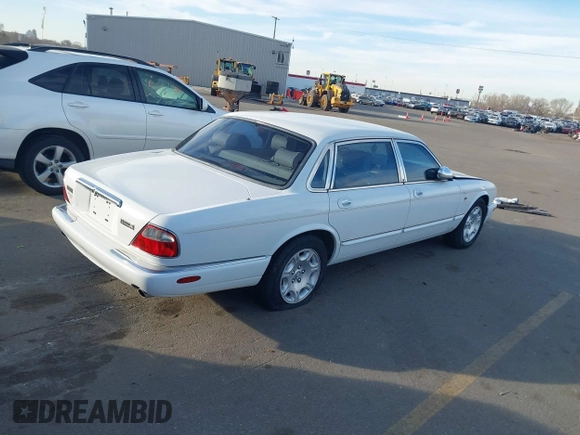 1998 Jaguar XJ Vanden Plas with VIN SAJKX6241WC829353, listed as a IAAI auction lot 41872667 with Not Provided miles and . Bid and sale history available at DreamBid. Image 4.