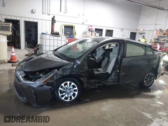 2021 Toyota Prius L Eco z VIN JTDKAMFU9M3132587, wystawiony jako IAAI lot #41637275 z przebiegiem 84 203 mil mil oraz . Historia ofert i sprzedaży dostępna na DreamBid. Obrazek 14.