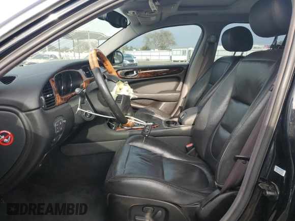2004 Jaguar XJ with VIN SAJEA71C54SG01455, listed as a Copart auction lot 86591014 with 83,977 mi miles and Salvage Title. Bid and sale history available at carsss.com. Image 7.