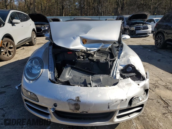 2008 Porsche 911 Carrera S z VIN WP0CB29998S776812, wystawiony jako Copart lot #86967074 z przebiegiem Nie podano mil oraz Szkoda całkowita • Salvage title. Historia ofert i sprzedaży dostępna na DreamBid. Obrazek 5.