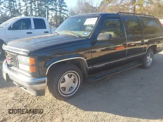 1999 GMC Suburban with VIN 3GKEC16R6XG549656, listed as a IAAI auction lot 41403259 with 306,548 mi miles. Bid and sale history available at carsss.com. Image 2.