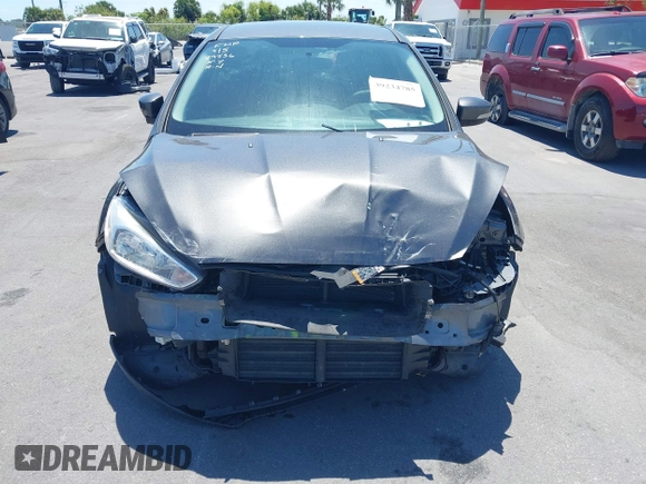 2016 Ford Focus SE z VIN 1FADP3F25GL338158, wystawiony jako IAAI lot #39234785 z przebiegiem 77 333 mil mil oraz . Historia ofert i sprzedaży dostępna na DreamBid. Obrazek 6.