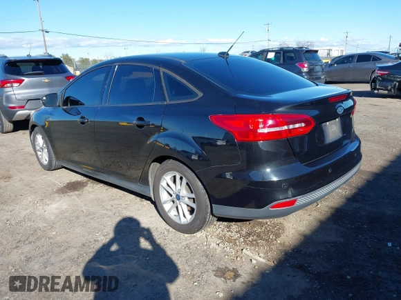2015 Ford Focus SE with VIN 1FADP3F21FL262033, listed as a IAAI auction lot 41521714 with 101,890 mi miles. Bid and sale history available at carsss.com. Image 3.
