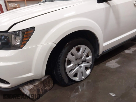 2015 Dodge Journey American Value z VIN 3C4PDCAB4FT714200, wystawiony jako IAAI lot #42199910 z przebiegiem 205 009 mil mil oraz . Historia ofert i sprzedaży dostępna na DreamBid. Obrazek 6.