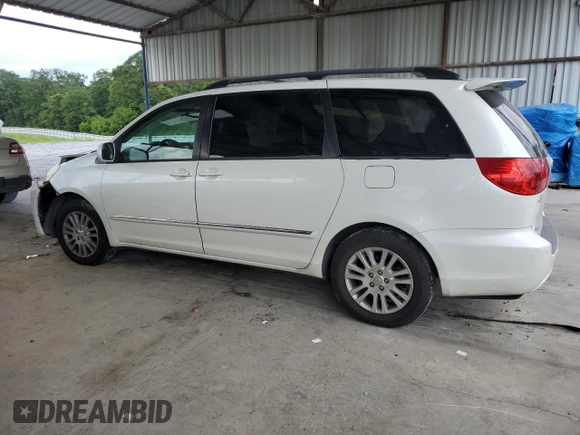 2010 Toyota Sienna XLE with VIN 5TDYK4CCXAS335064, listed as a Copart auction lot 62649665 with 246,327 mi miles and Salvage title. Bid and sale history available at DreamBid. Image 2.