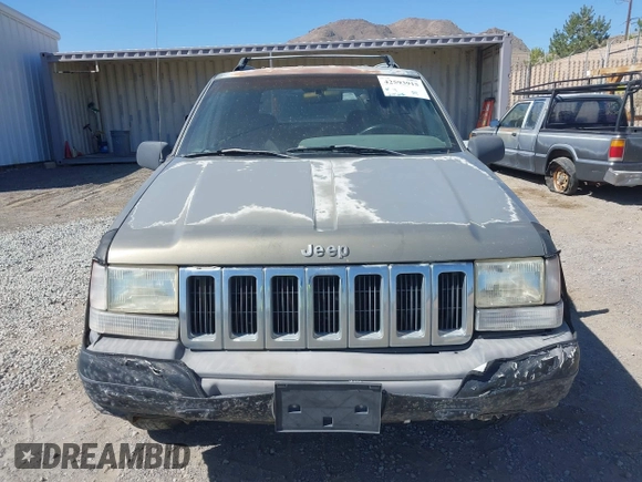 1997 Jeep Grand Cherokee Laredo with VIN 1J4GZ58S3VC603239, listed as a IAAI auction lot 42593915 with 295,696 mi miles and . Bid and sale history available at DreamBid. Image 6.