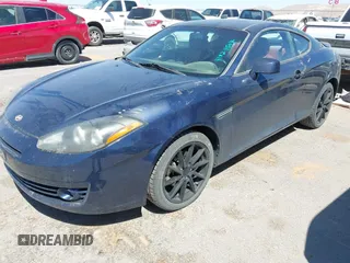 2008 Hyundai Tiburon GT z VIN KMHHN66F28U280572, wystawiony jako IAAI lot #41824507 z przebiegiem 189 851 mil mil oraz . Historia ofert i sprzedaży dostępna na DreamBid. Obrazek 2.