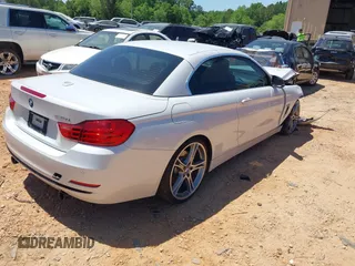 2014 BMW 4 Series 435i z VIN WBA3T3C5XEP737022, wystawiony jako IAAI lot #42135541 z przebiegiem 70 080 mil mil oraz . Historia ofert i sprzedaży dostępna na DreamBid. Obrazek 4.