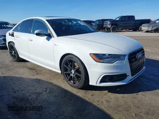 2012 Audi A6 3.0T Prestige with VIN WAUHGAFC8CN112409, listed as a IAAI auction lot 41577304 with 123,759 mi miles. Bid and sale history available at carsss.com. Image 1.