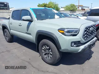 2023 Toyota Tacoma SR with VIN 3TMCZ5AN3PM590101, listed as a IAAI auction lot 42338670 with 12,970 mi miles and . Bid and sale history available at DreamBid. Image 1.