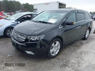 2012 Honda Odyssey Touring with VIN 5FNRL5H96CB058828, listed as a IAAI auction lot 41731389 with 152,295 mi miles and . Bid and sale history available at DreamBid. Image 2.