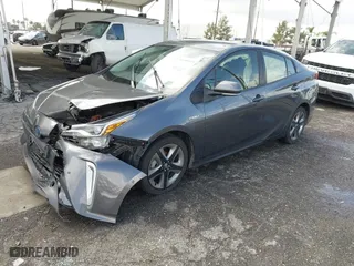 2022 Toyota Prius L Eco with VIN JTDKAMFU7N3155268, listed as a IAAI auction lot 41589024 with 158,430 mi miles. Bid and sale history available at carsss.com. Image 2.