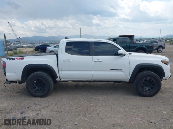 2022 Toyota Tacoma SR with VIN 3TMCZ5AN1NM478457, listed as a IAAI auction lot 42479107 with 59,547 mi miles and . Bid and sale history available at DreamBid. Image 14.