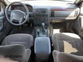 2000 Jeep Grand Cherokee Laredo z VIN 1J4GW48N9YC239166, wystawiony jako Copart lot #53321135 z przebiegiem 142 162 mil mil oraz Szkoda całkowita • Salvage title. Historia ofert i sprzedaży dostępna na DreamBid. Obrazek 8.