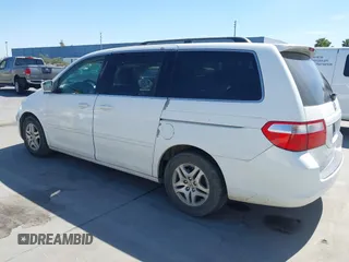 2005 Honda Odyssey EX-L with VIN 5FNRL38605B045246, listed as a IAAI auction lot 42183883 with 164,072 mi miles and . Bid and sale history available at carsss.com. Image 3.