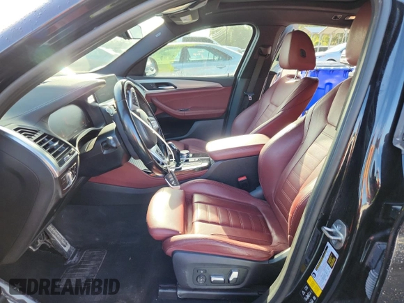 2021 BMW X4 M40i with VIN 5UX2V5C05M9F68427, listed as a Copart auction lot 64941095 with 50,208 mi miles and Salvage title. Bid and sale history available at DreamBid. Image 7.