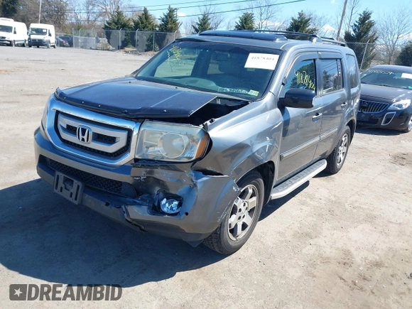 2011 Honda Pilot Touring with VIN 5FNYF4H95BB090892, listed as a IAAI auction lot 41878404 with 131,757 mi miles. Bid and sale history available at carsss.com. Image 17.